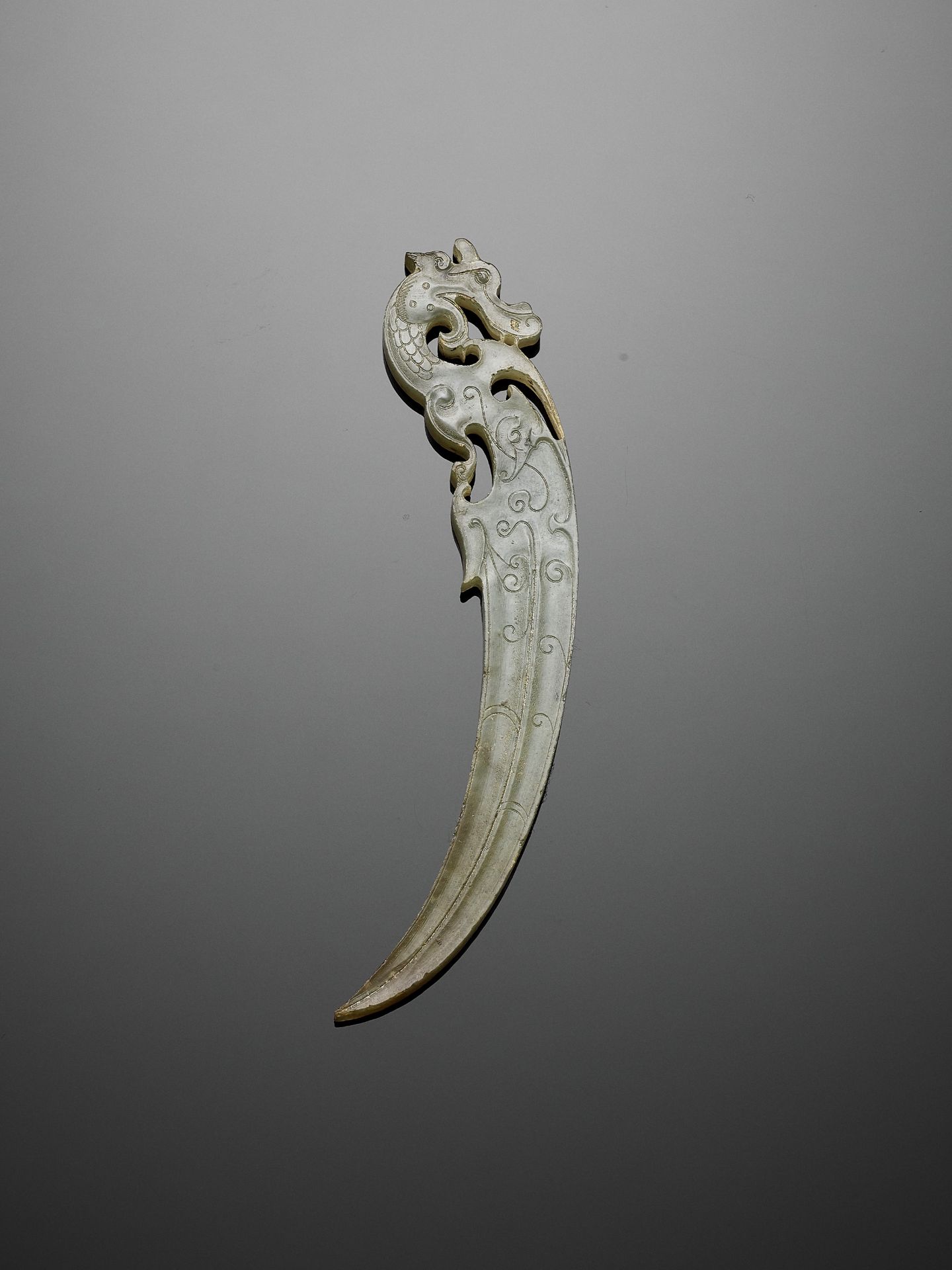 A JADE 'DRAGON' PENDANT, XI, WARRING STATES PERIOD