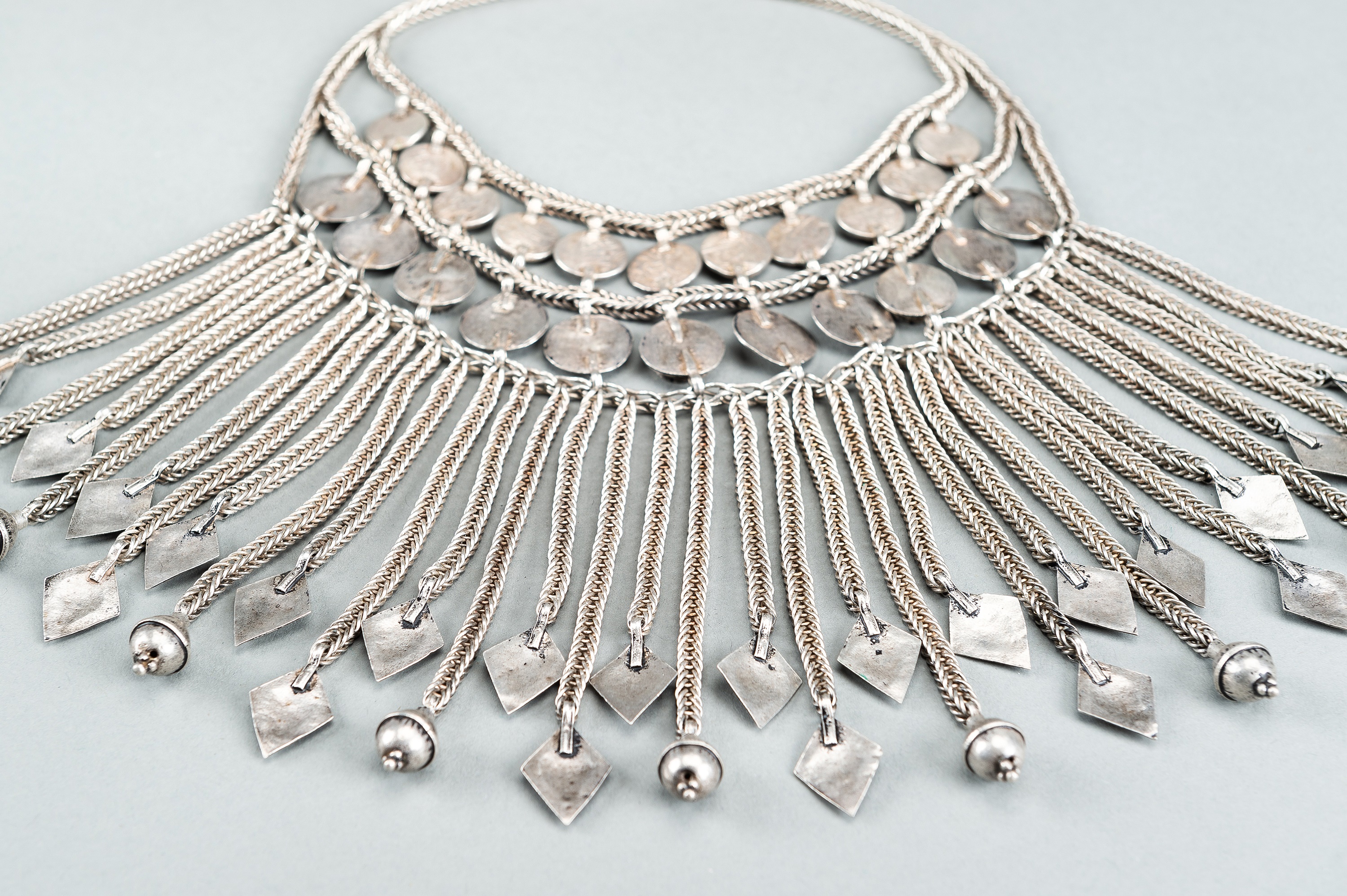 A TRIBAL AFGHAN MULTI-STRAND SILVER NECKLACE WITH GLASS INSETS, c. 1950s - Image 12 of 13