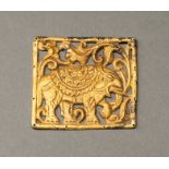 A SOUTHEAST ASIAN GOLD REPOUSSE PLAQUE WITH AN ELEPHANT