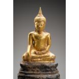 A THAI GOLD AND SILVER FOIL SUKHOTHAI STYLE FIGURE OF BUDDHA SHAKYAMUNI