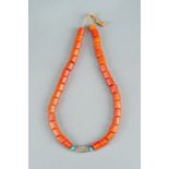 A NAGALAND 'CORAL' GLASS NECKLACE, c. 1900s