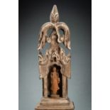 A TEAKWOOD SHRINE WITH A MONK, 19th CENTURY