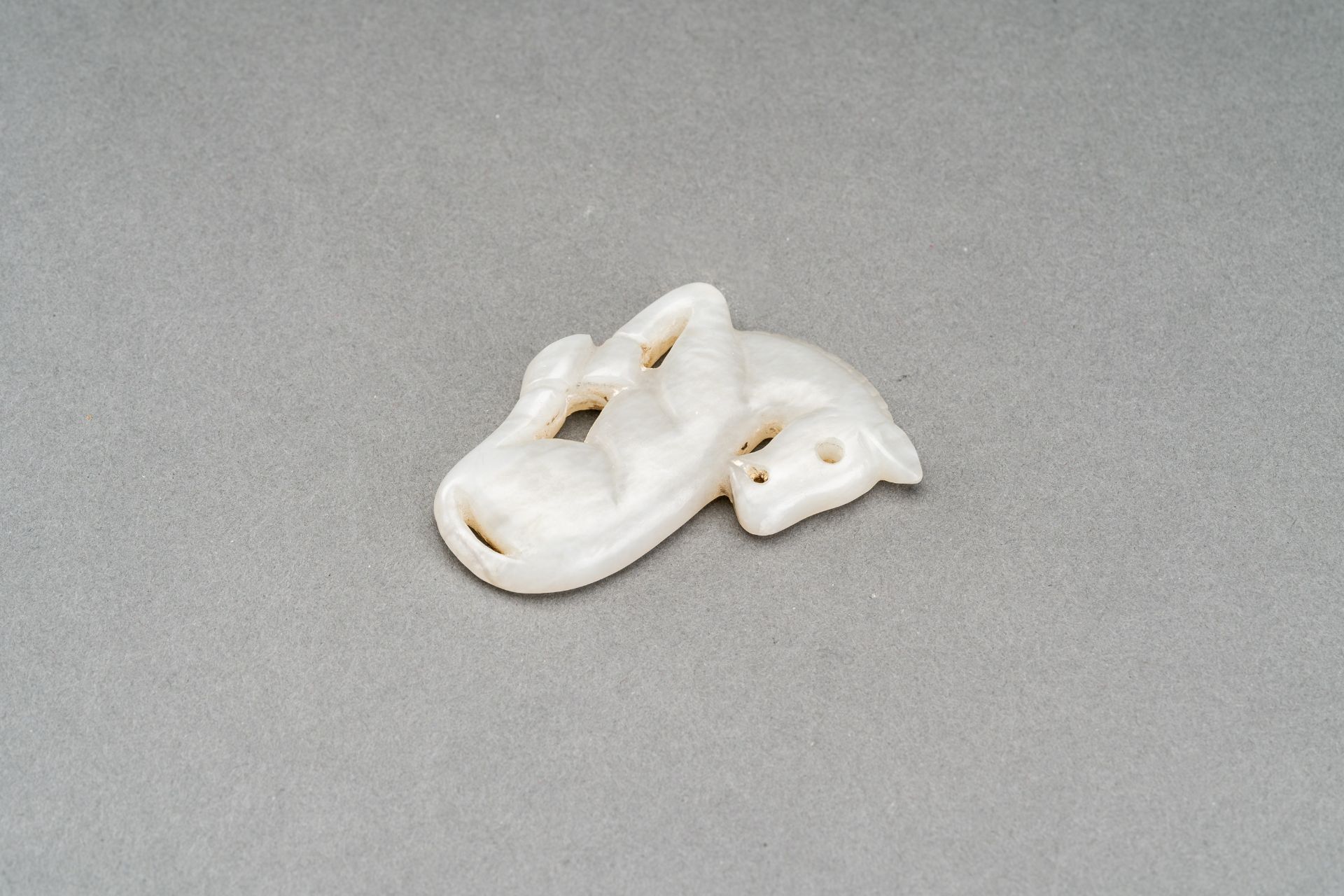 A GRAY JADE PENDANT OF A RECUMBENT HORSE, c. 1920s - Image 7 of 7