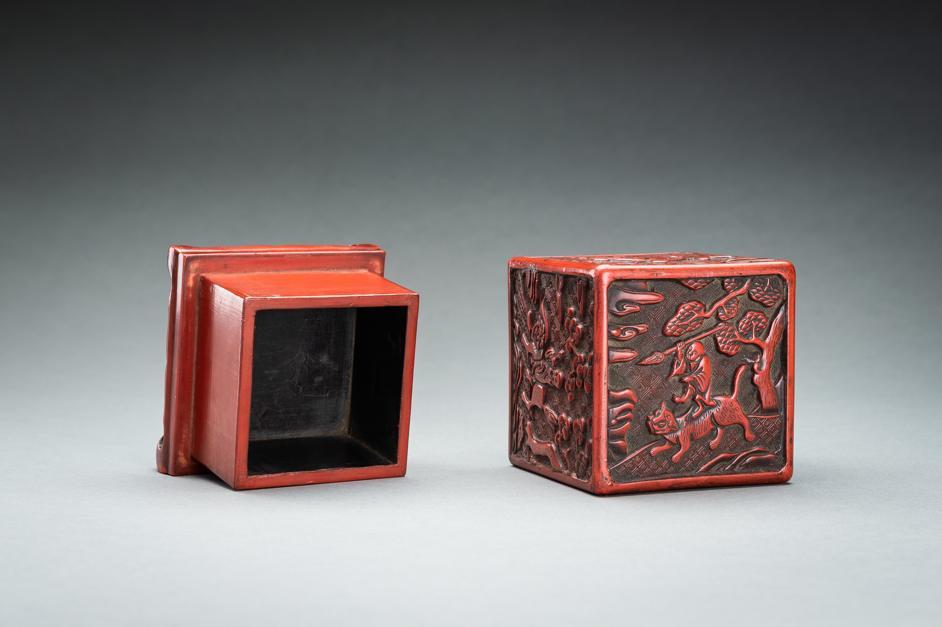A CINNABAR LACQUER 'IMMORTALS AND BUDAI' BOX AND COVER, QING - Image 13 of 14