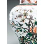 A LARGE FAMILLE VERTE 'MAGPIES AND FLOWERSÂ´ BALUSTER VASE AND COVER, QING