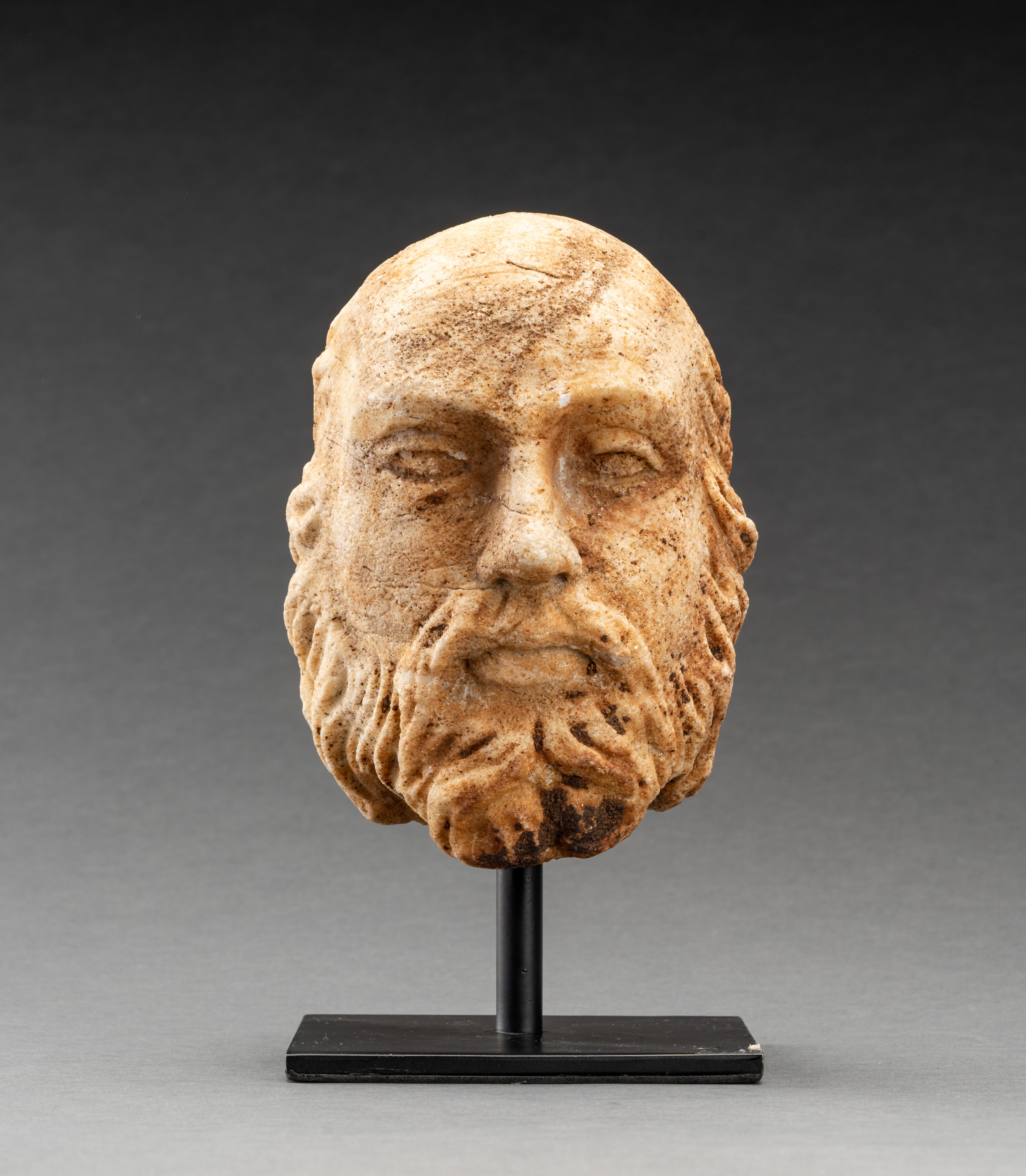 A GANDHARAN WHITE MARBLE HEAD OF A BEARDED MAN