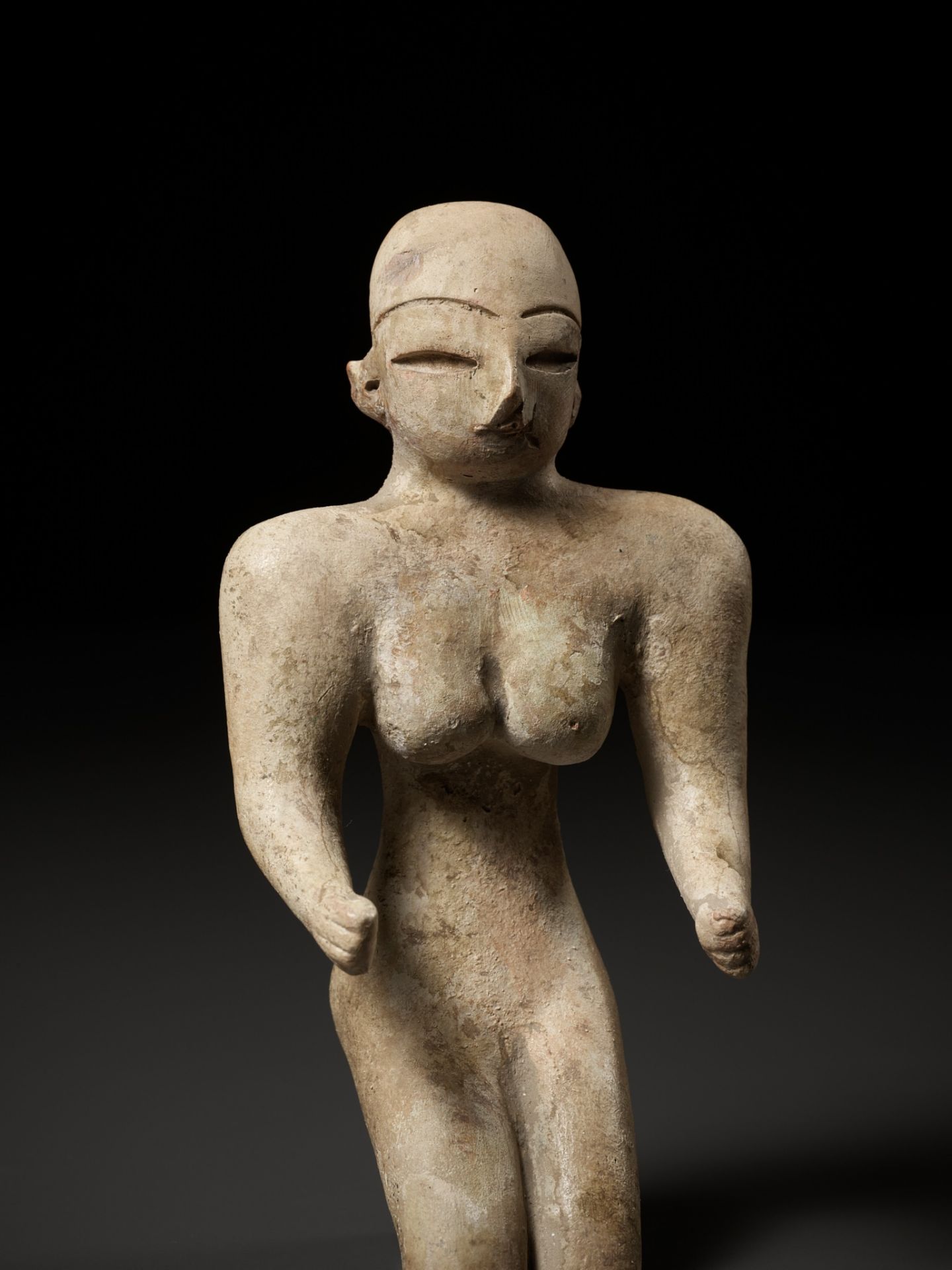 A TERRACOTTA FIGURE OF A SEATED MOTHER GODDESS, MATURE HARAPPAN