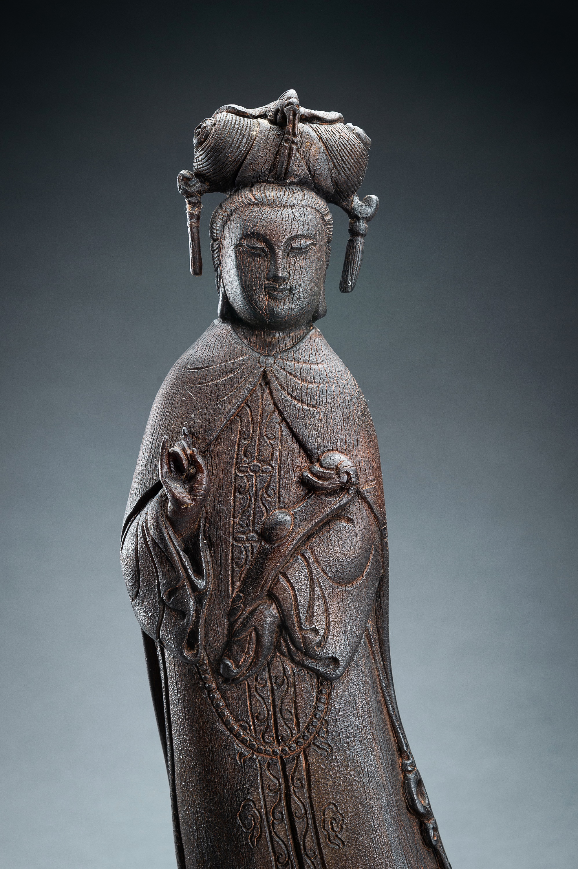 AN IRONWOOD FIGURE OF GUANYIN, c. 1920s