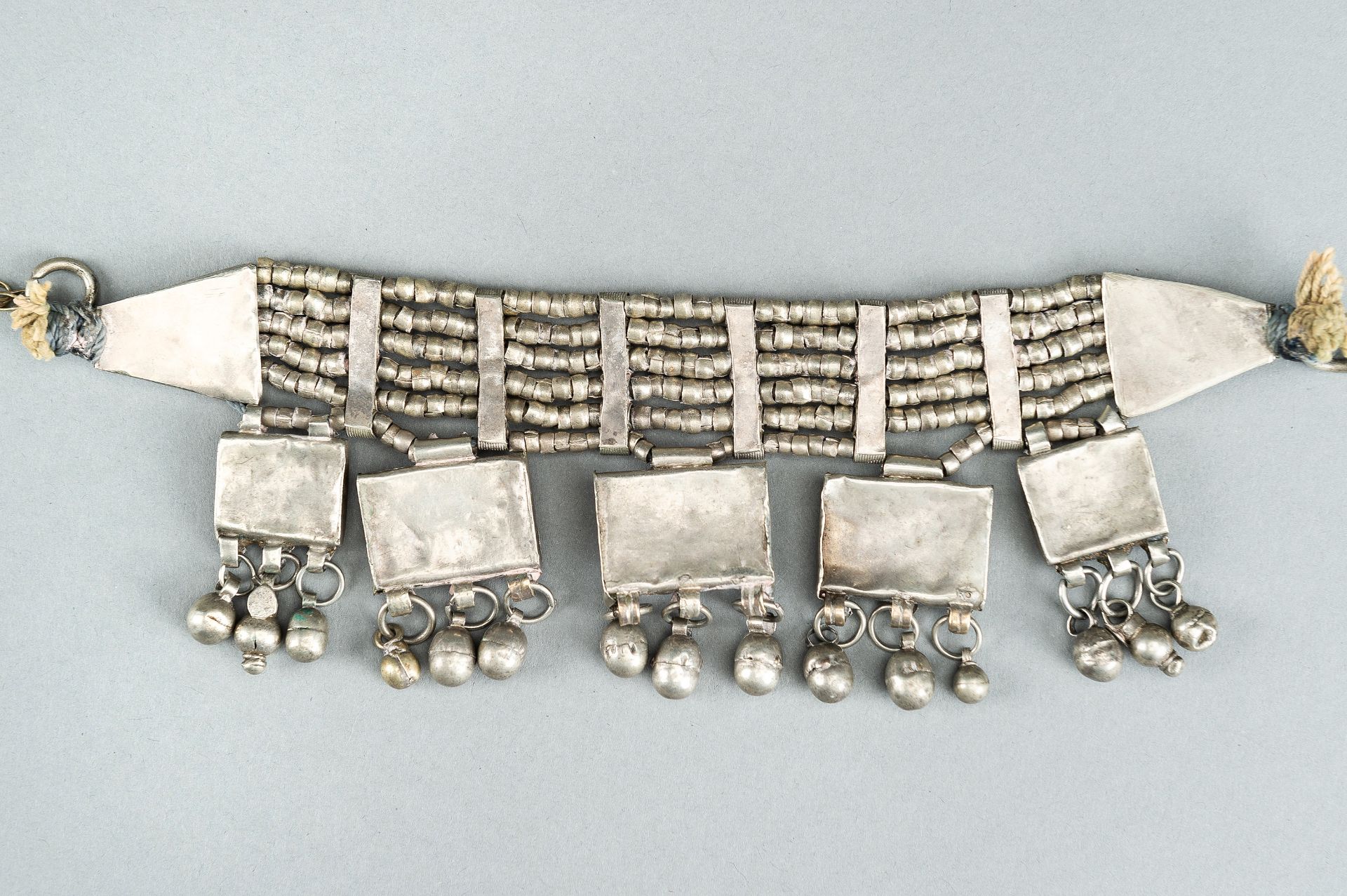 A GROUP OF THREE WHITE METAL LAZEM AMULET NECKLACES, c 1930s - Bild 16 aus 16