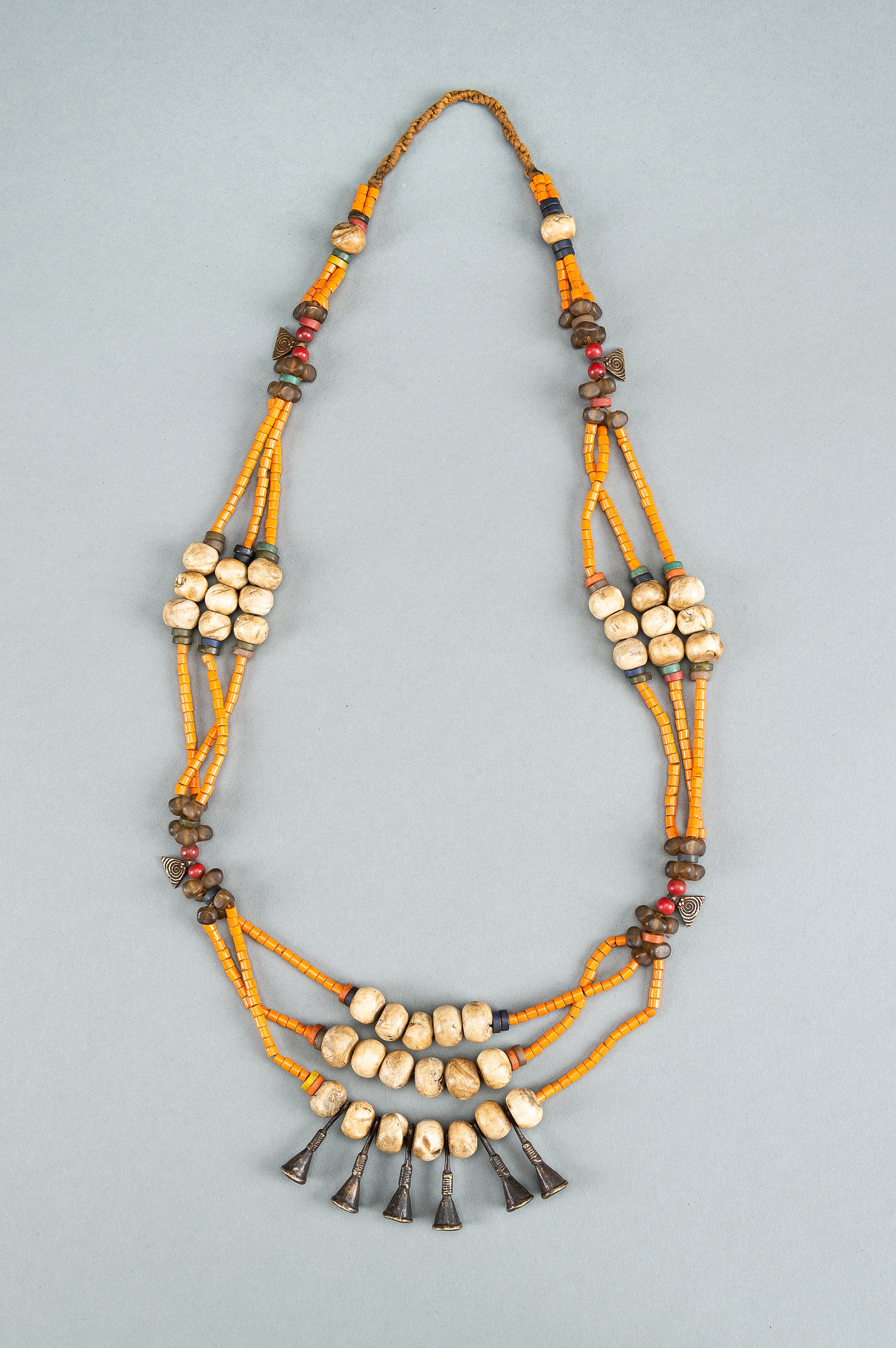 A NAGALAND MULTI-COLORED GLASS, BRASS AND SHELL NECKLACE, c. 1900s