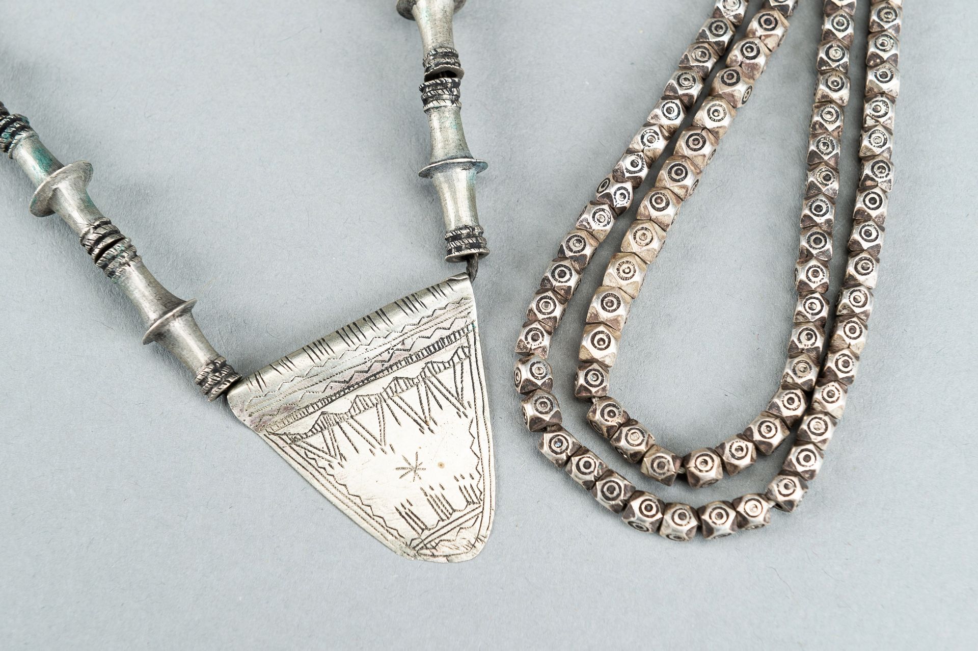 TWO MIDDLE EASTERN SILVER AND METAL NECKLACES, c. 1900s