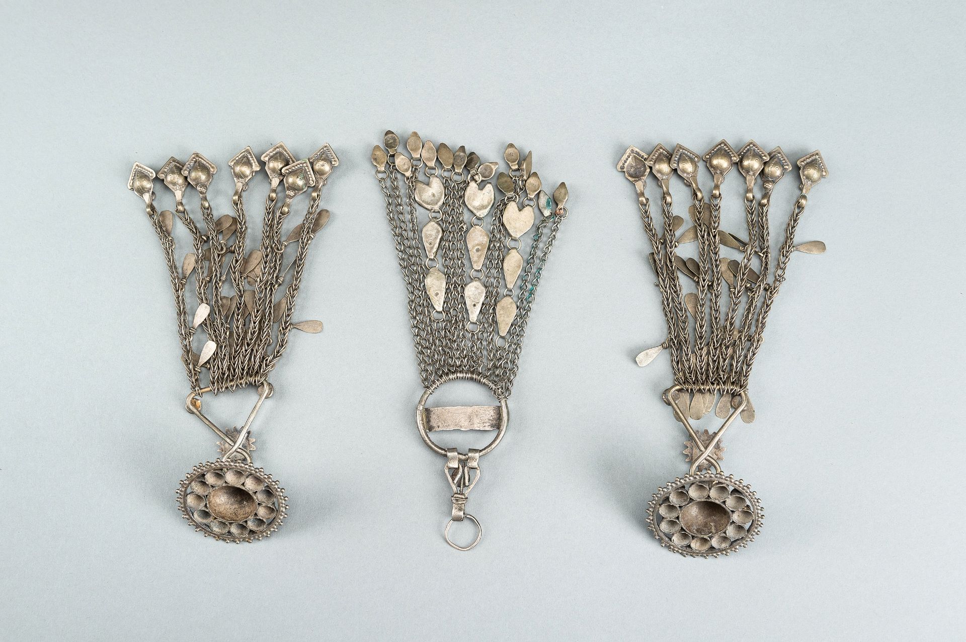 THREE TRIBAL AFGHAN METAL ORNAMENTS WITH INSETS, c. 1950s - Image 15 of 16