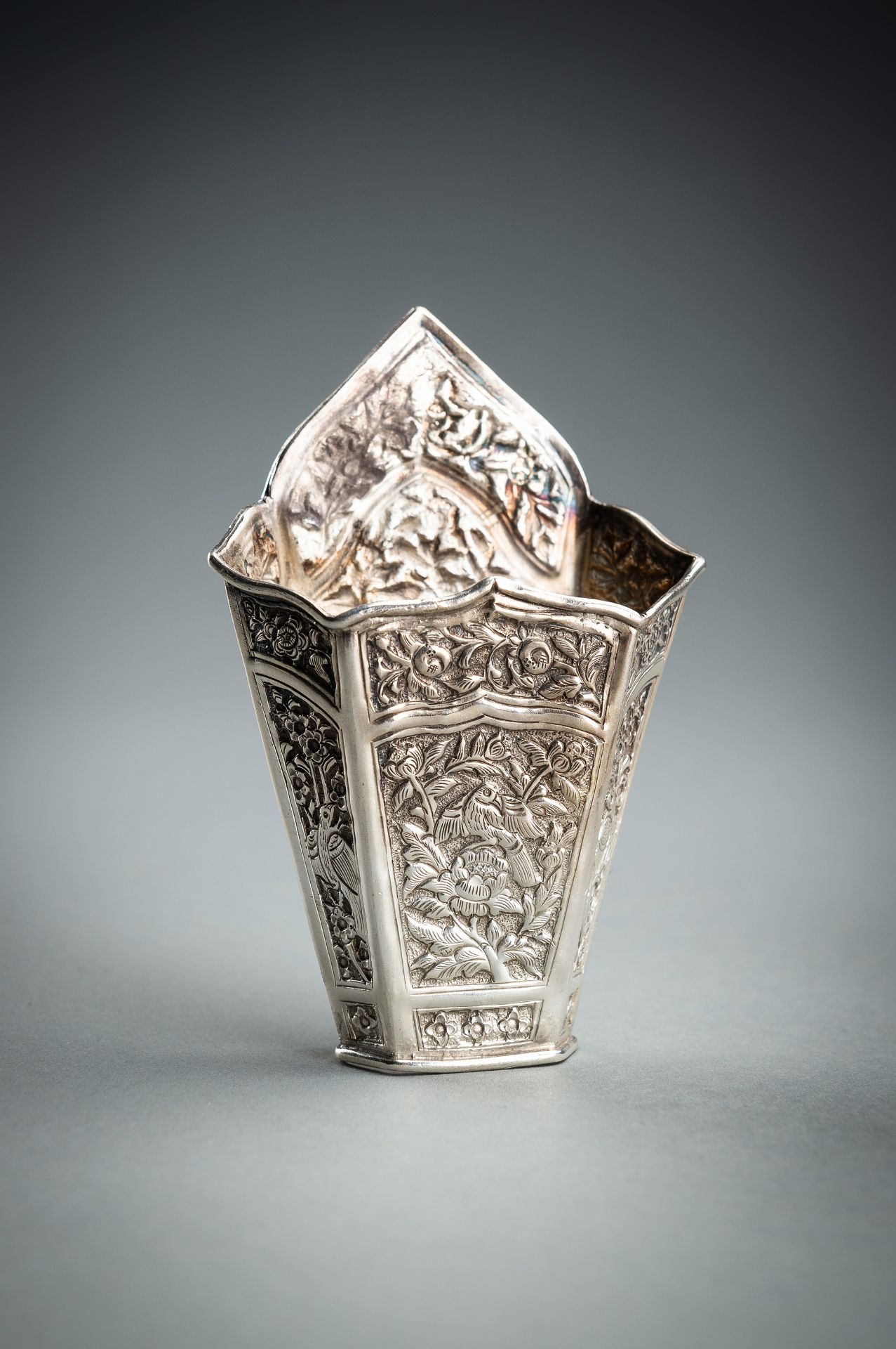 A GROUP OF FIVE EMBOSSED SILVER BETEL LEAF HOLDERS, c. 1900s - Image 18 of 19