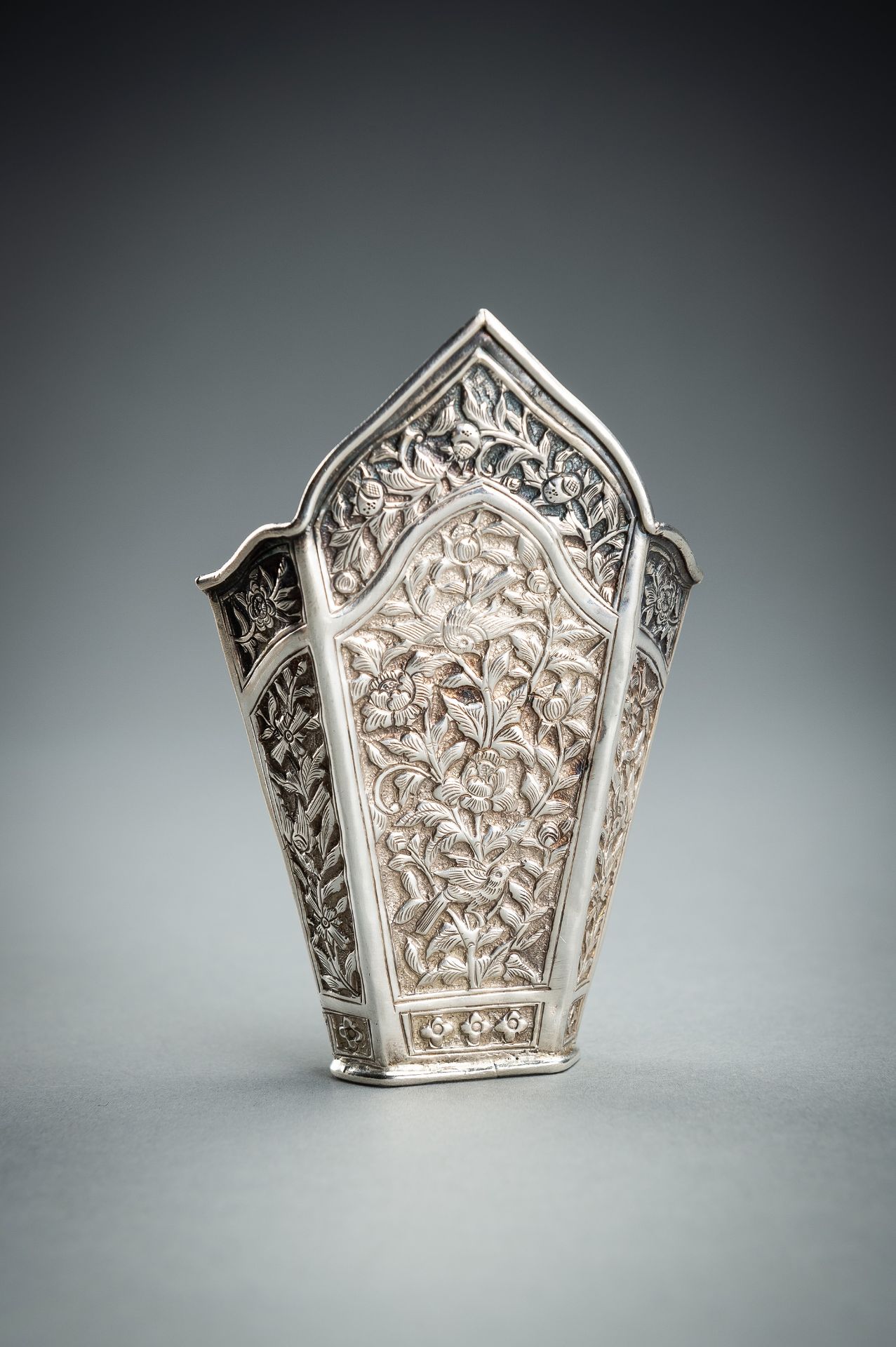 A GROUP OF FIVE EMBOSSED SILVER BETEL LEAF HOLDERS, c. 1900s - Image 17 of 19