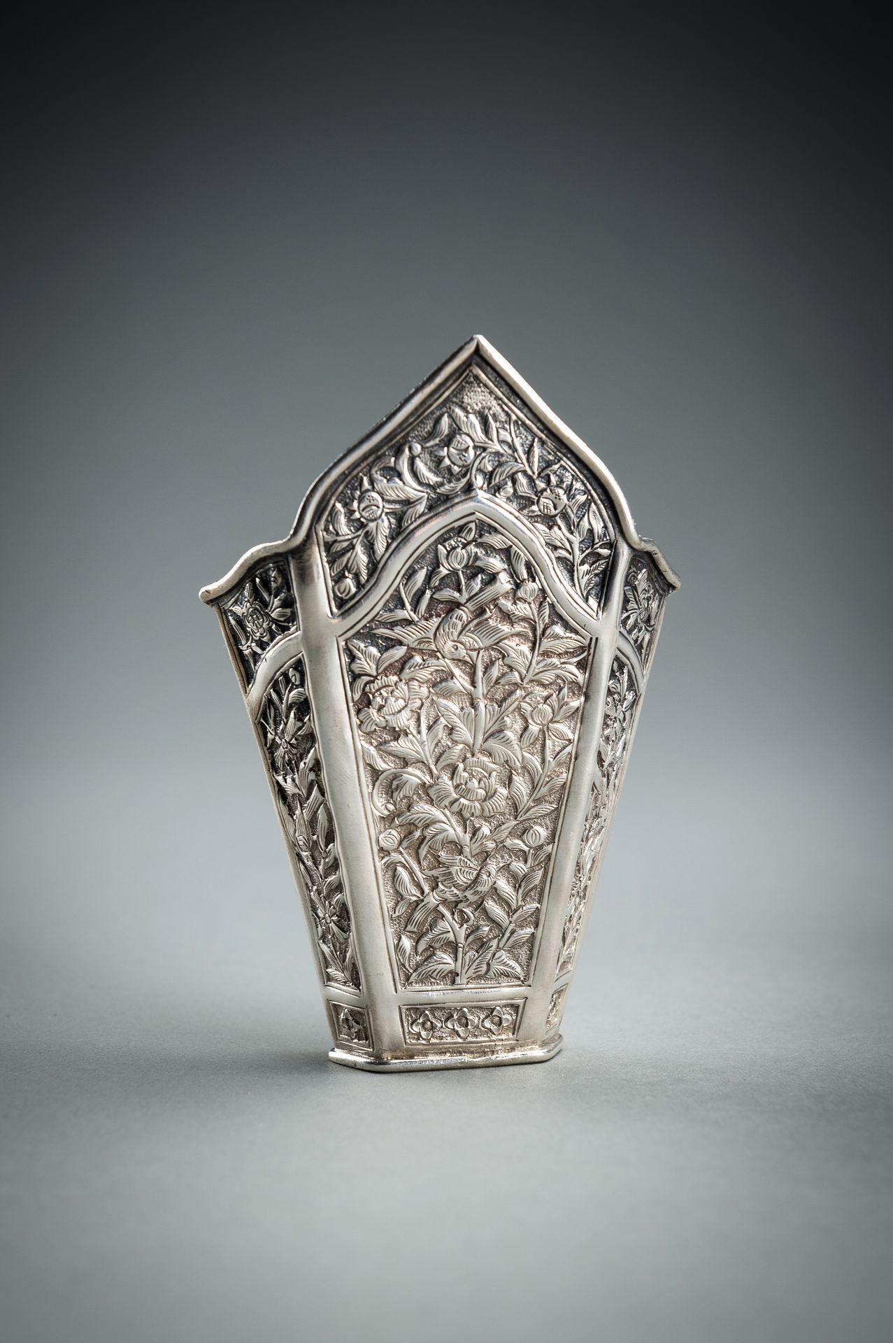 A GROUP OF FIVE EMBOSSED SILVER BETEL LEAF HOLDERS, c. 1900s - Image 19 of 19