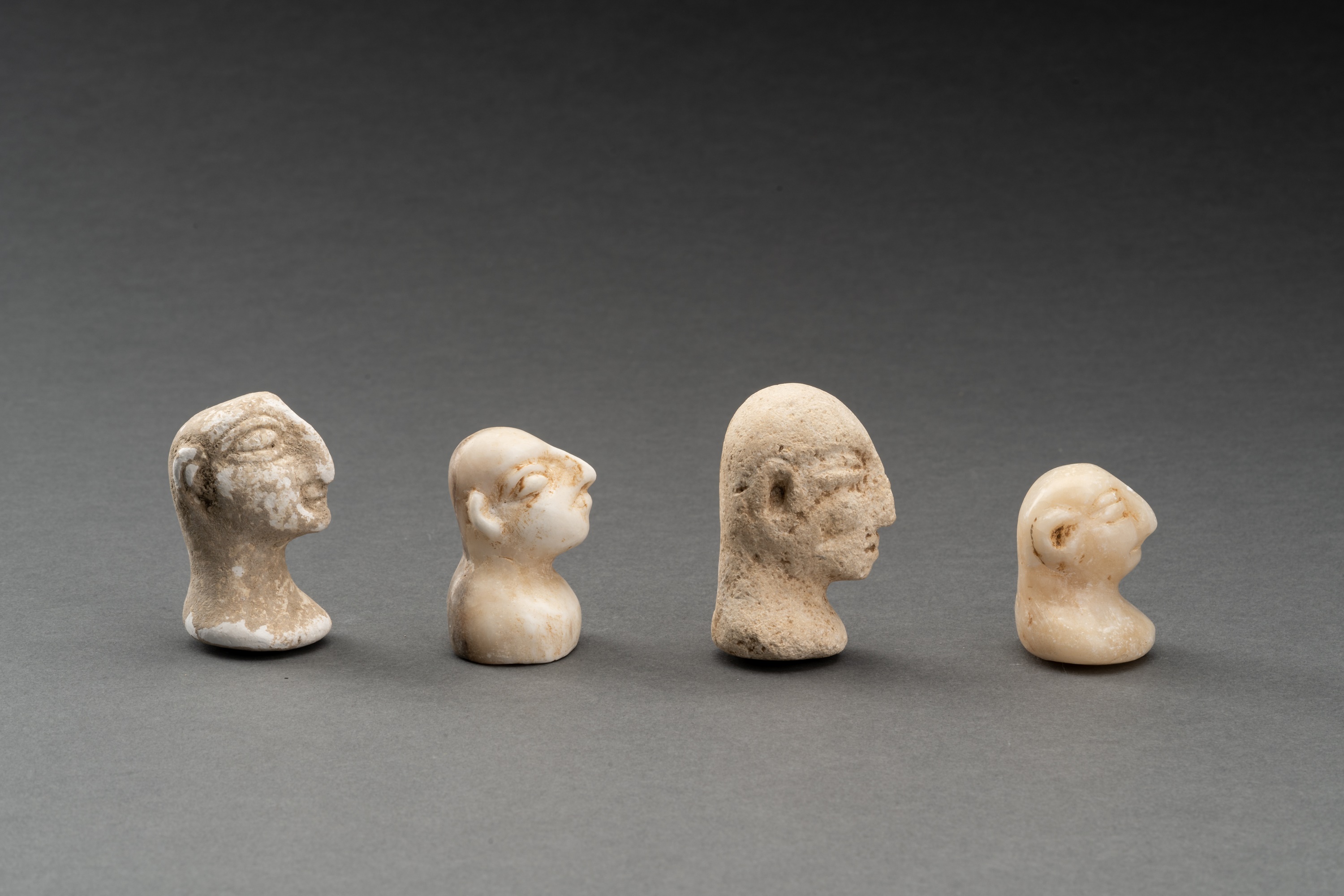 A LOT WITH FOUR BACTRIAN WHITE MARBLE AND STONE IDOL HEADS - Image 5 of 7