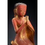 A BURMESE LACQUERED PAPER MACHE FIGURE OF A MONK, 18th - 19th CENTURY