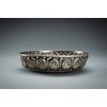 A RETICUALTED BURMESE SILVER REPOUSSE BOWL