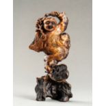 AN EXPRESSIVE ROOT WOOD FIGURE OF A BOY, QING