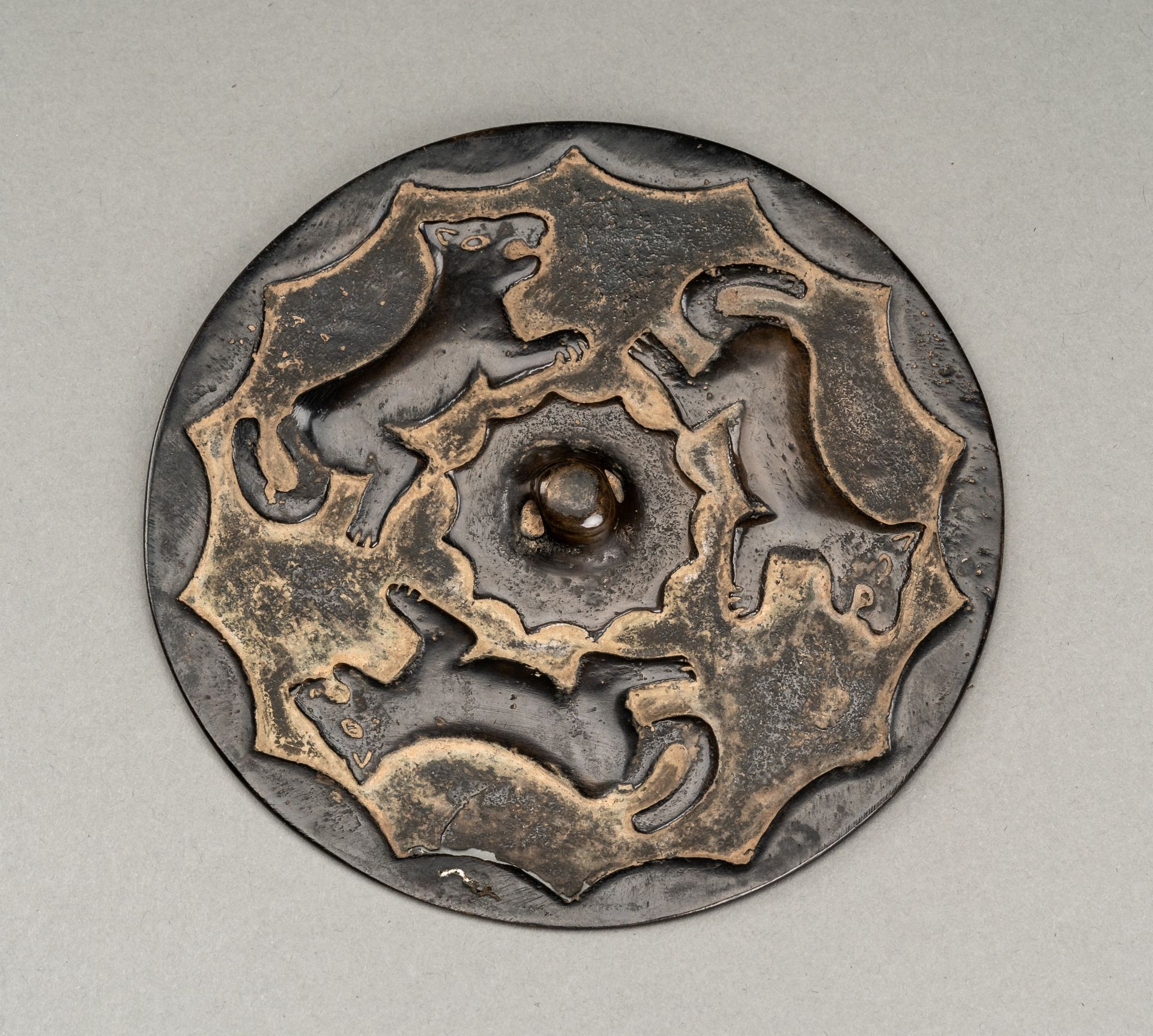 A RARE TANG DYNASTY BRONZE MIRROR WITH WOLFES