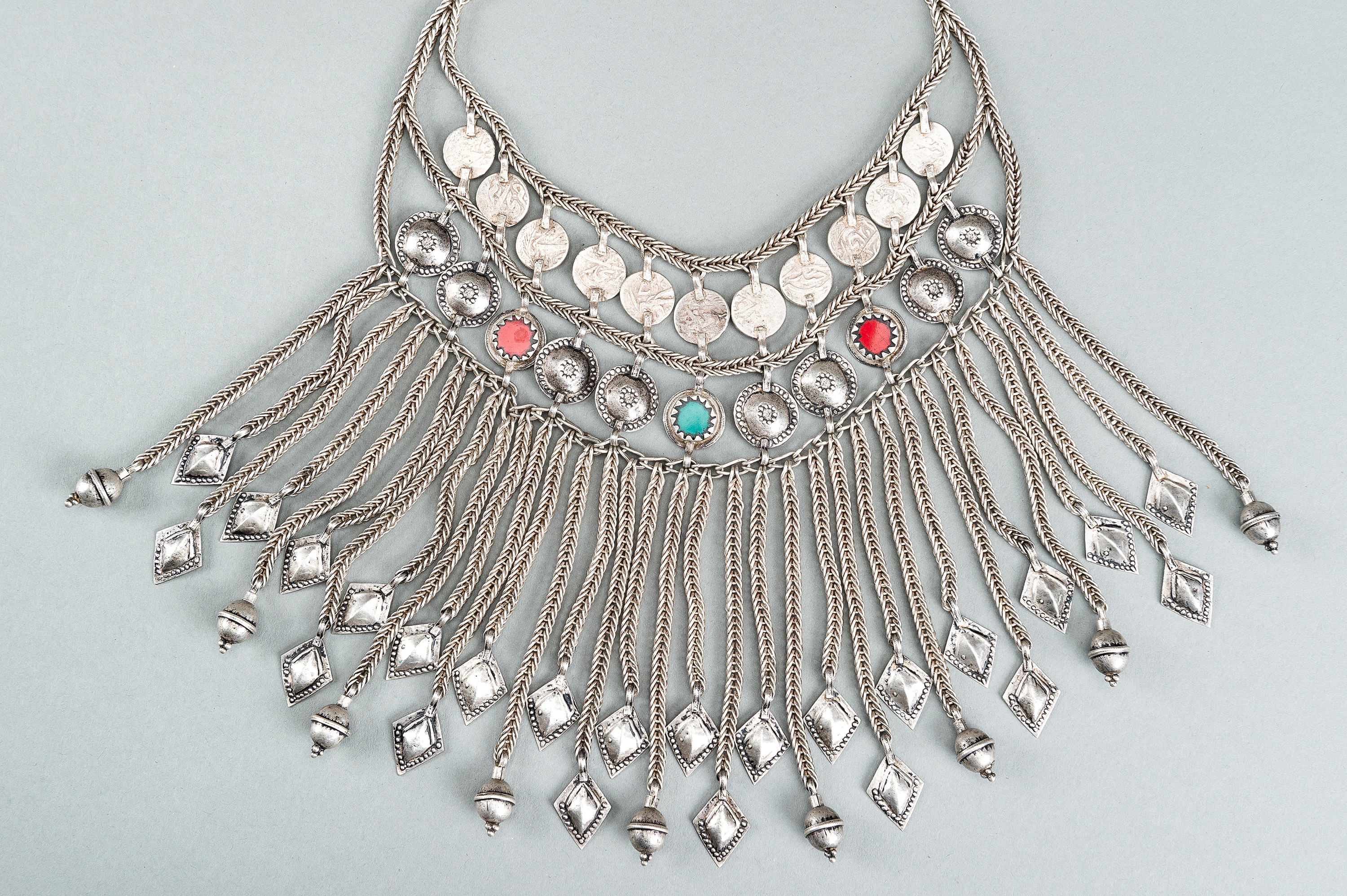 A TRIBAL AFGHAN MULTI-STRAND SILVER NECKLACE WITH GLASS INSETS, c. 1950s