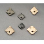 A LOT WITH SIX THREE-POINTED LINGLING-O STONE PENDANTS