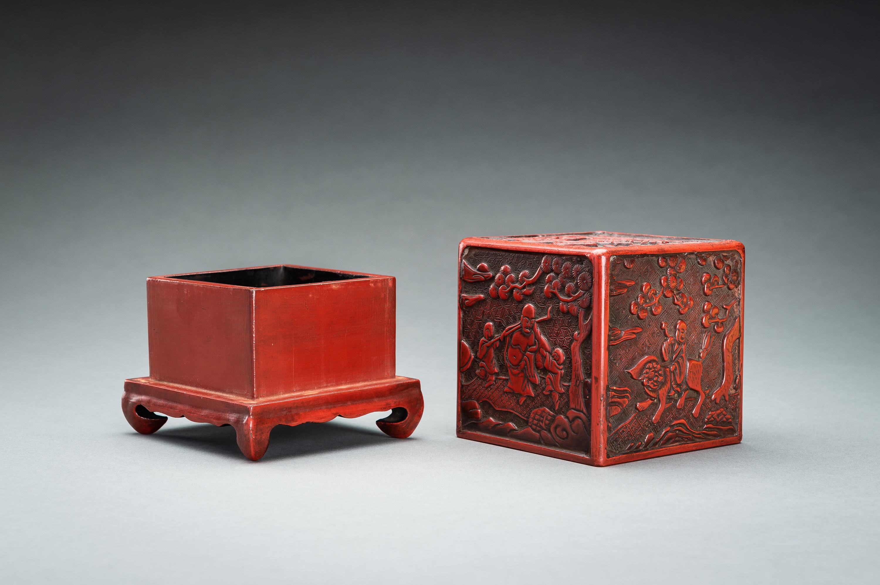 A CINNABAR LACQUER 'IMMORTALS AND BUDAI' BOX AND COVER, QING - Image 12 of 14