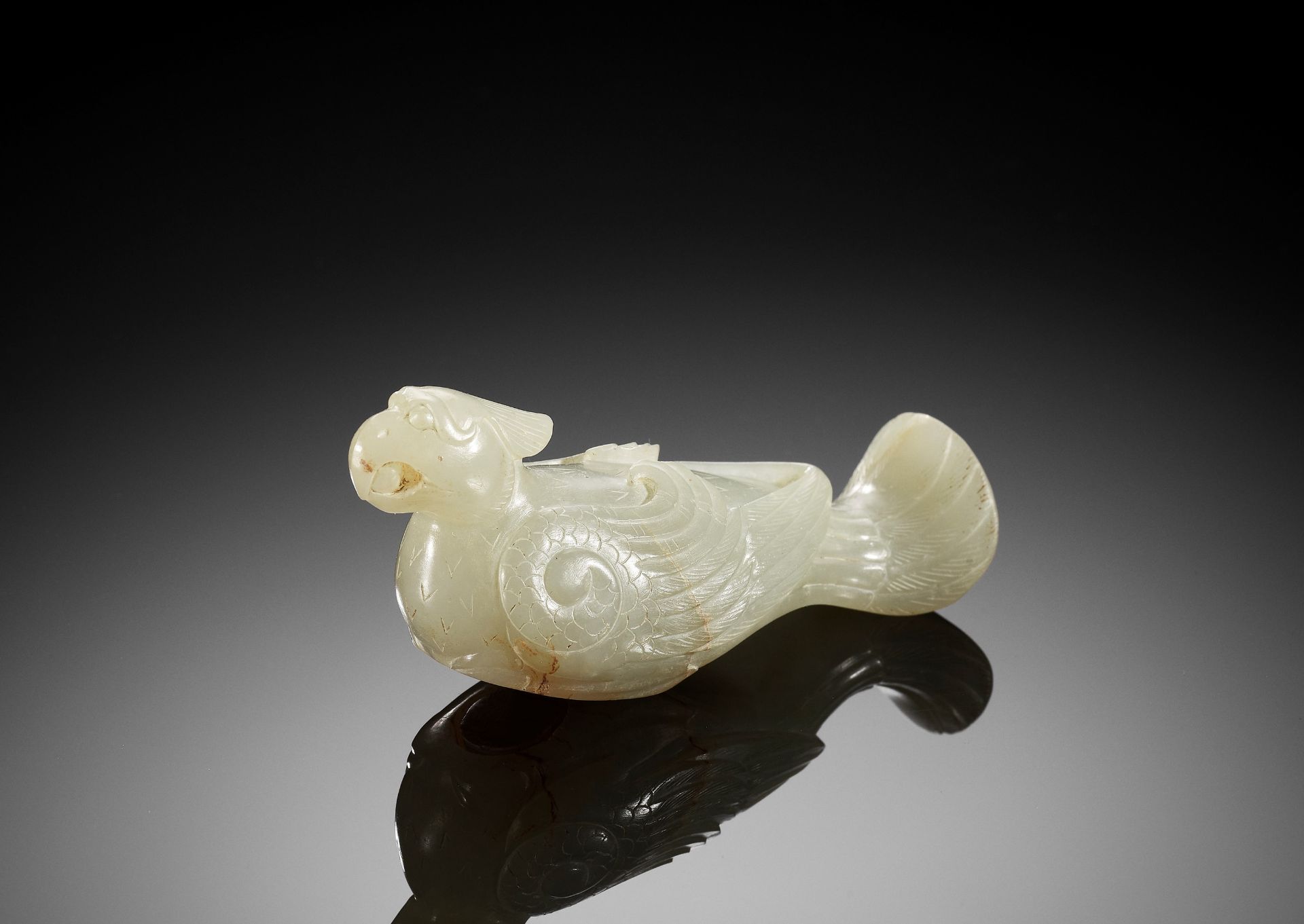 A CELADON JADE 'TURTLEDOVE' FINIAL, JIU, HAN DYNASTY