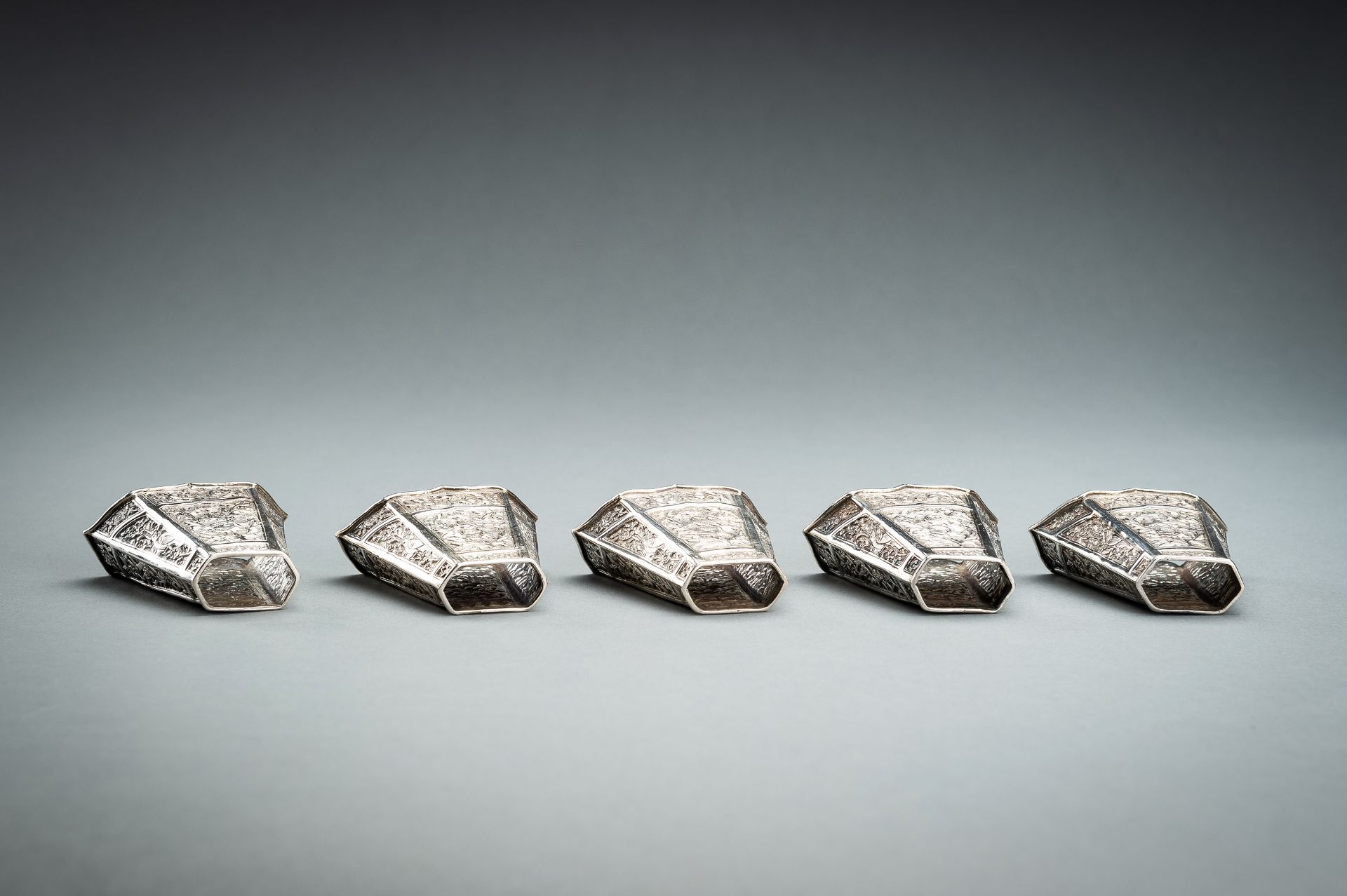 A GROUP OF FIVE EMBOSSED SILVER BETEL LEAF HOLDERS, c. 1900s - Image 7 of 19