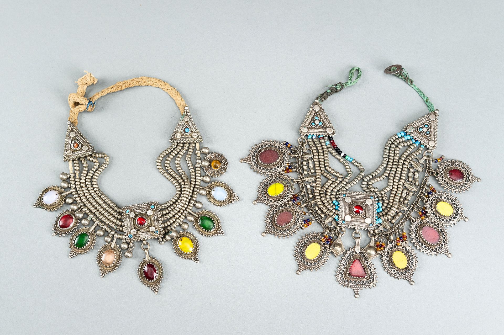 TWO TRIBAL AFGHAN MULTI-COLORED GLASS AND METAL NECKLACES, c. 1950s