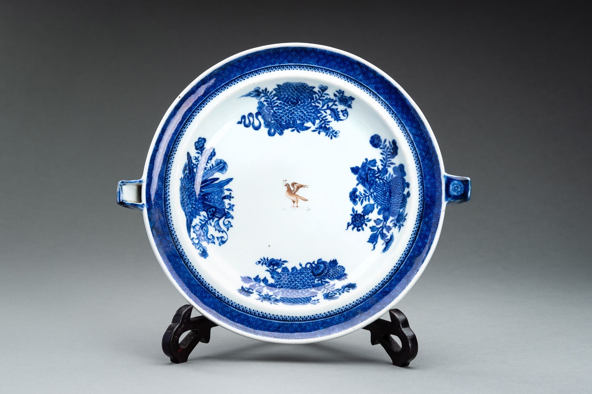 A BLUE AND WHITE FITZHUGH ARMORIAL PORCELAIN HOT WATER PLATE