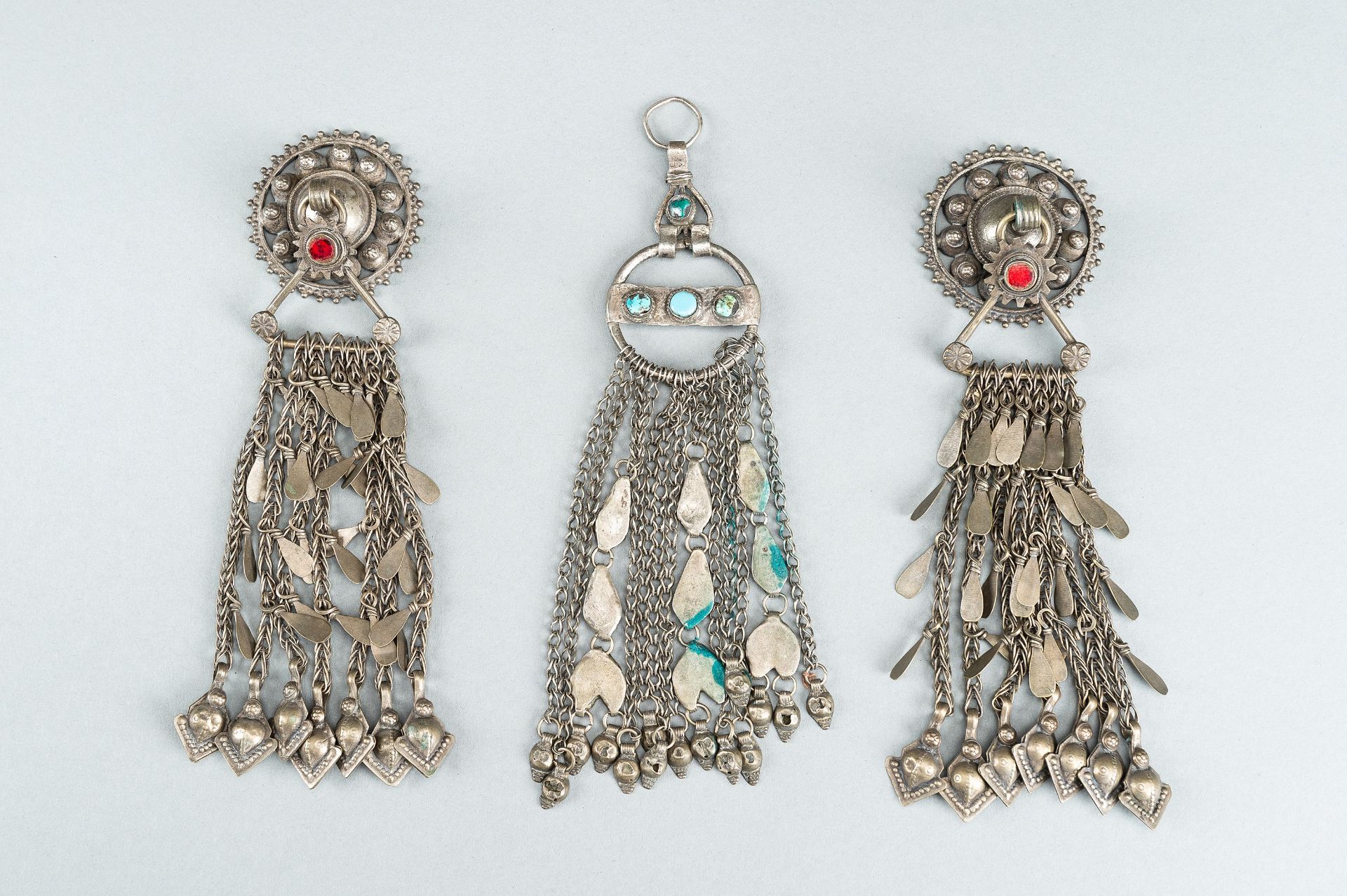 THREE TRIBAL AFGHAN METAL ORNAMENTS WITH INSETS, c. 1950s - Image 14 of 16