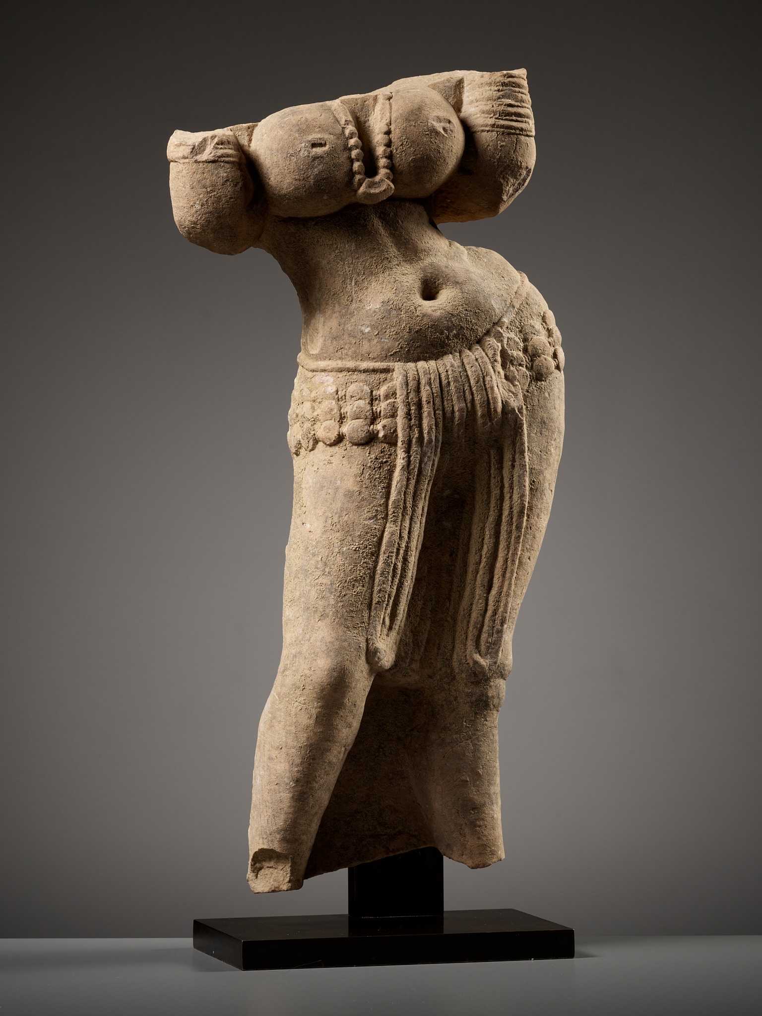 A SANDSTONE TORSO OF A YAKSHI, INDIA, MATHURA, KUSHAN PERIOD, 1ST-2ND CENTURY