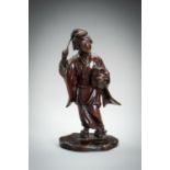 SEIYA: A PATINATED BRONZE OKIMONO OF A GEISHA, MEIJI