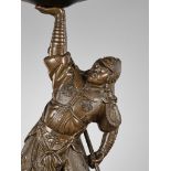 A BRONZE FIGURE OF A SAMURAI LIFTING A GONG