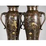 A SUPERB PAIR OF MIYAO-STYLE MIXED-METAL-INLAID AND PARCEL-GILT BRONZE VASES WITH SHOKI AND ONI