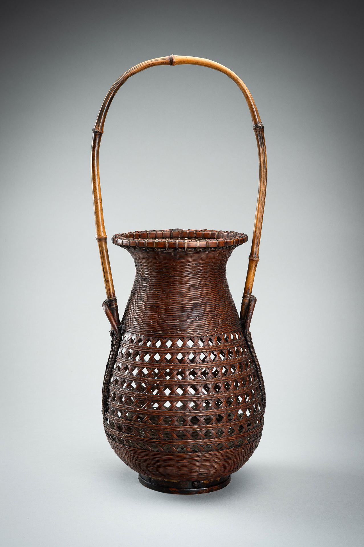 MAEDA CHIKUBOSAI II: A WOVEN BAMBOO AND RATTAN HANAKAGO (FLOWER BASKET)