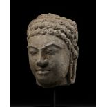 A SANDSTONE HEAD OF BUDDHA SHAKYAMUNI, MON-DVARAVATI PERIOD