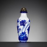 A SAPPHIRE-BLUE GLASS OVERLAY SNUFF BOTTLE, ATTRIBUTED TO THE IMPERIAL GLASSWORKS, BEIJING,1750-1790