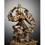 A BRASS FIGURE OF DURGA MAHISHASURAMARDINI, INDIA, 16TH-17TH CENTURY