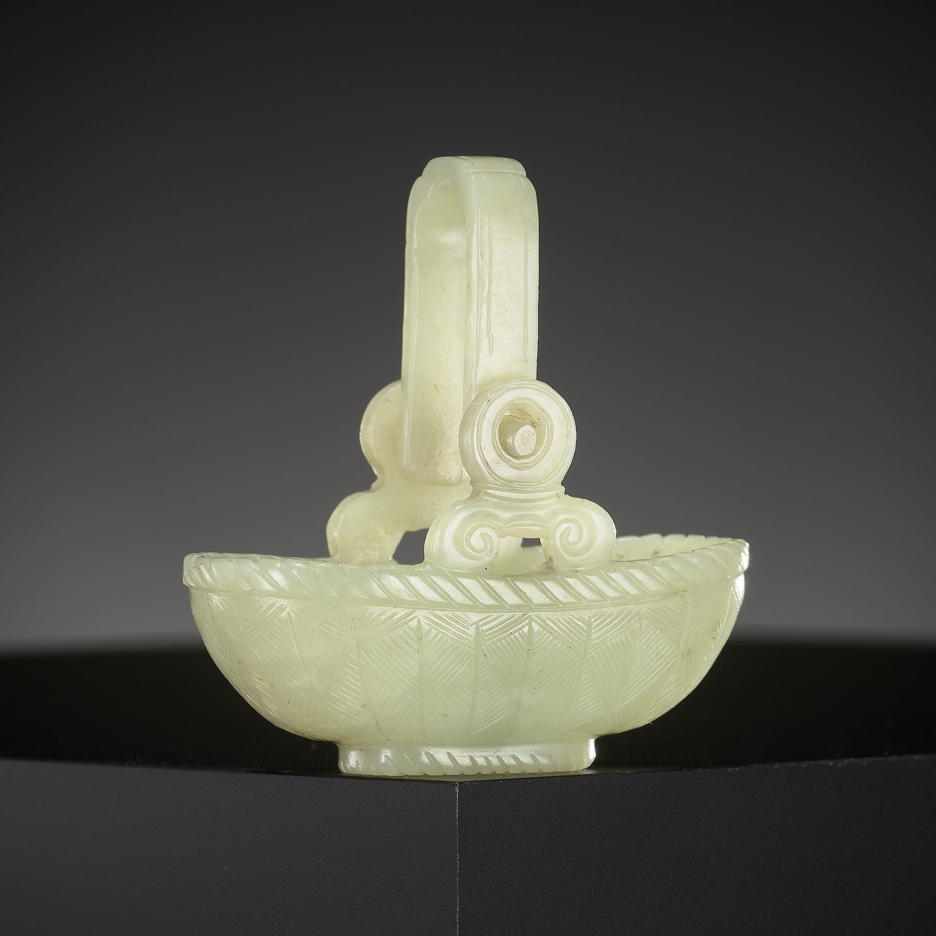 A YELLOW JADE CARVING OF A BASKET WITH MOVABLE HANDLE, CHINA, 18TH CENTURY
