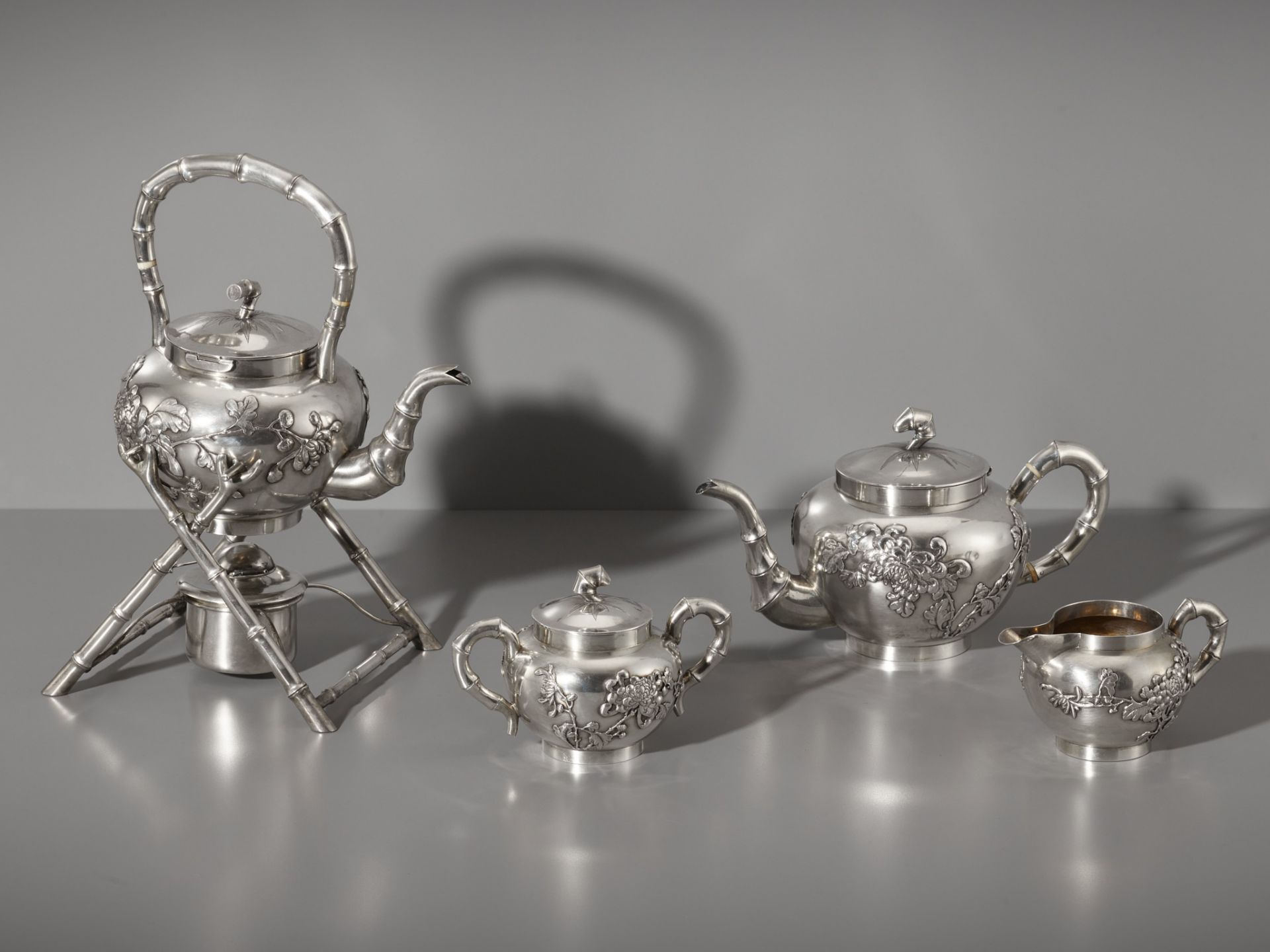 A SIX-PIECE ‘CHRYSANTHEMUM’ 900/1000 SILVER TEA & COFFEE SERVICE, OVER 2 KG TOTAL WEIGHT, LATE QING