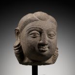 A PINK SANDSTONE HEAD OF A YAKSHI, MATHURA, KUSHAN PERIOD