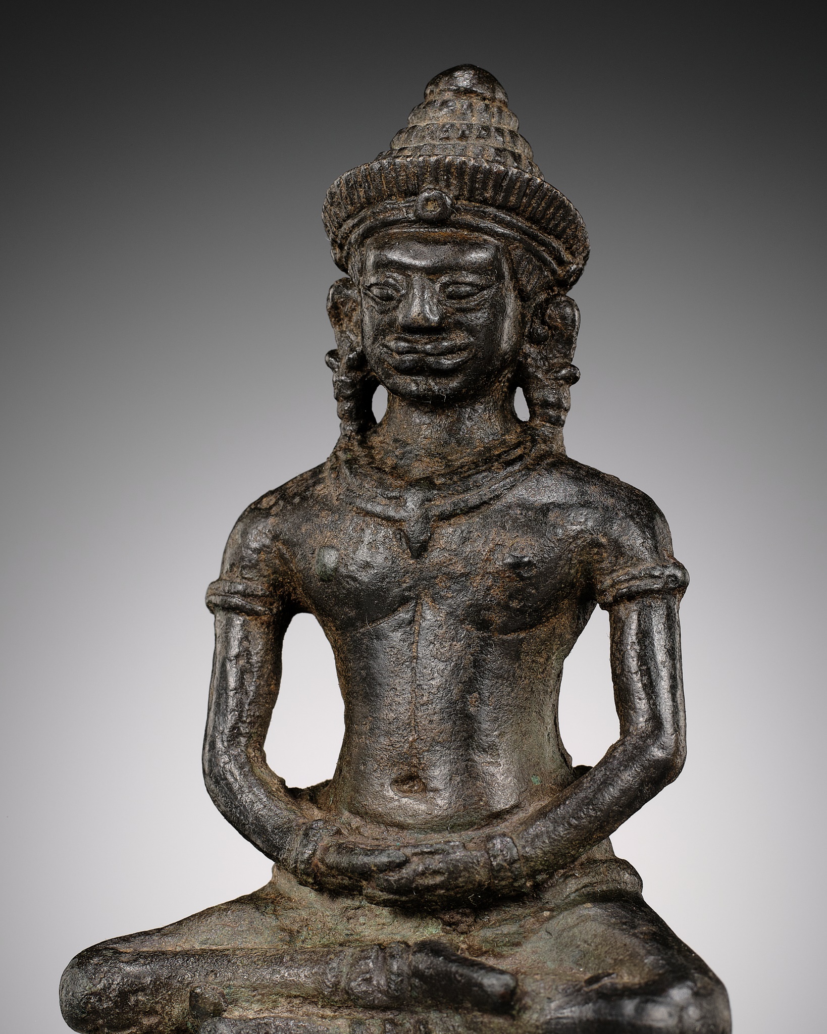 A BRONZE FIGURE OF BUDDHA, ANGKOR PERIOD, KHMER EMPIRE, 12TH CENTURY