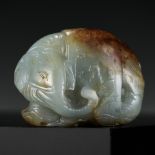 A CELADON AND RUSSET JADE CARVING OF AN ELEPHANT, LATE MING TO MID-QING DYNASTY