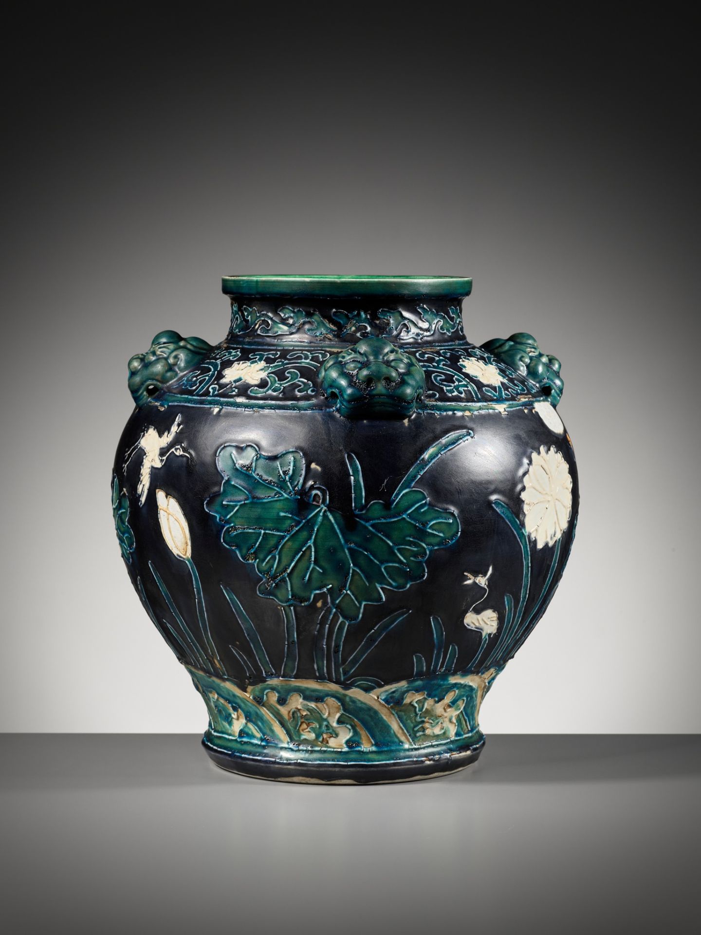 AN EARLY FAHUA-GLAZED 'LOTUS' JAR, GUAN, WITH FOUR LION-MASK HANDLES, MING DYNASTY - Image 6 of 14