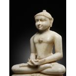 A JAIN WHITE MARBLE FIGURE OF A TIRTHANKARA, WESTERN INDIA, 17TH-18TH CENTURY