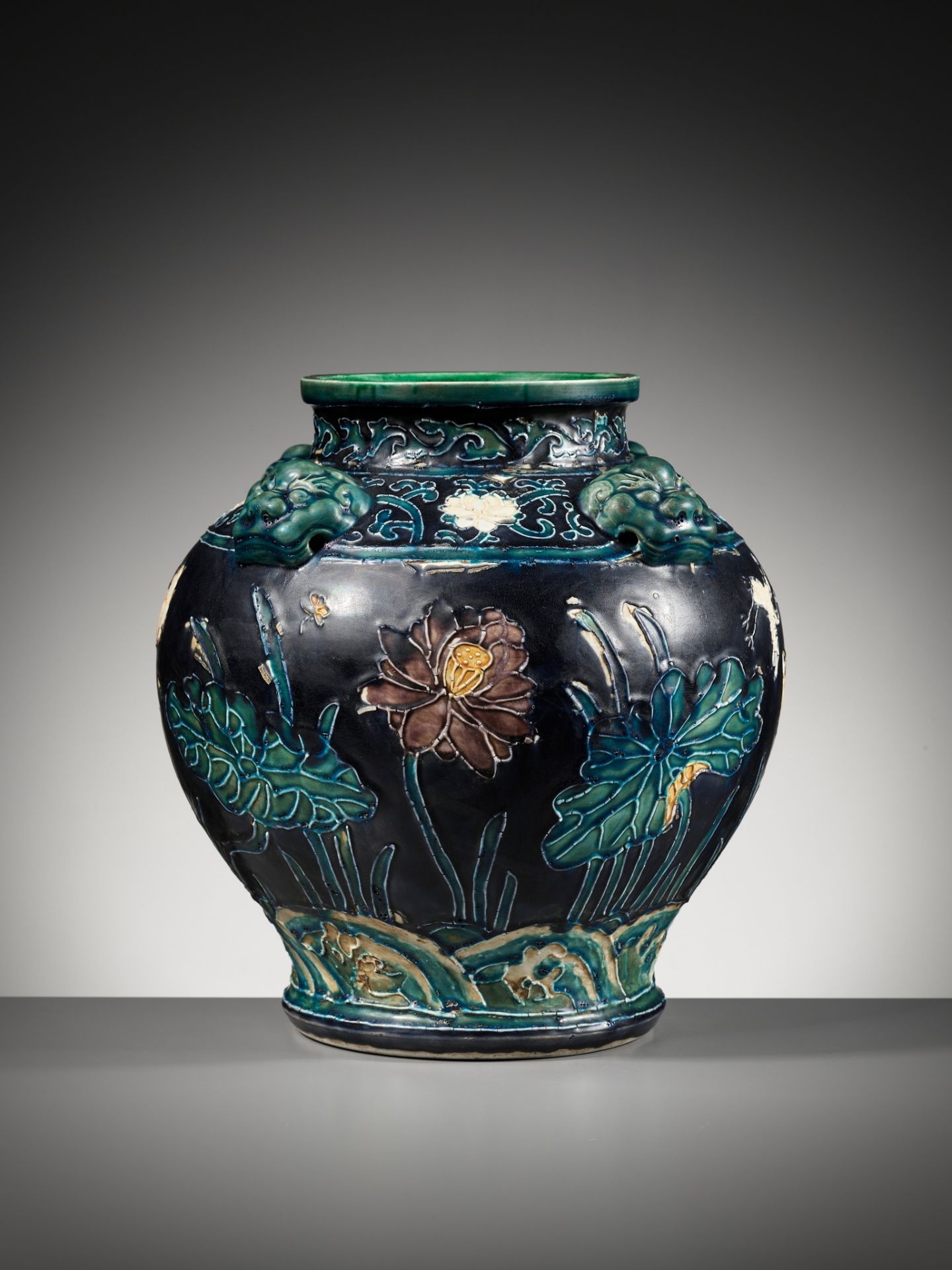 AN EARLY FAHUA-GLAZED 'LOTUS' JAR, GUAN, WITH FOUR LION-MASK HANDLES, MING DYNASTY - Image 3 of 14