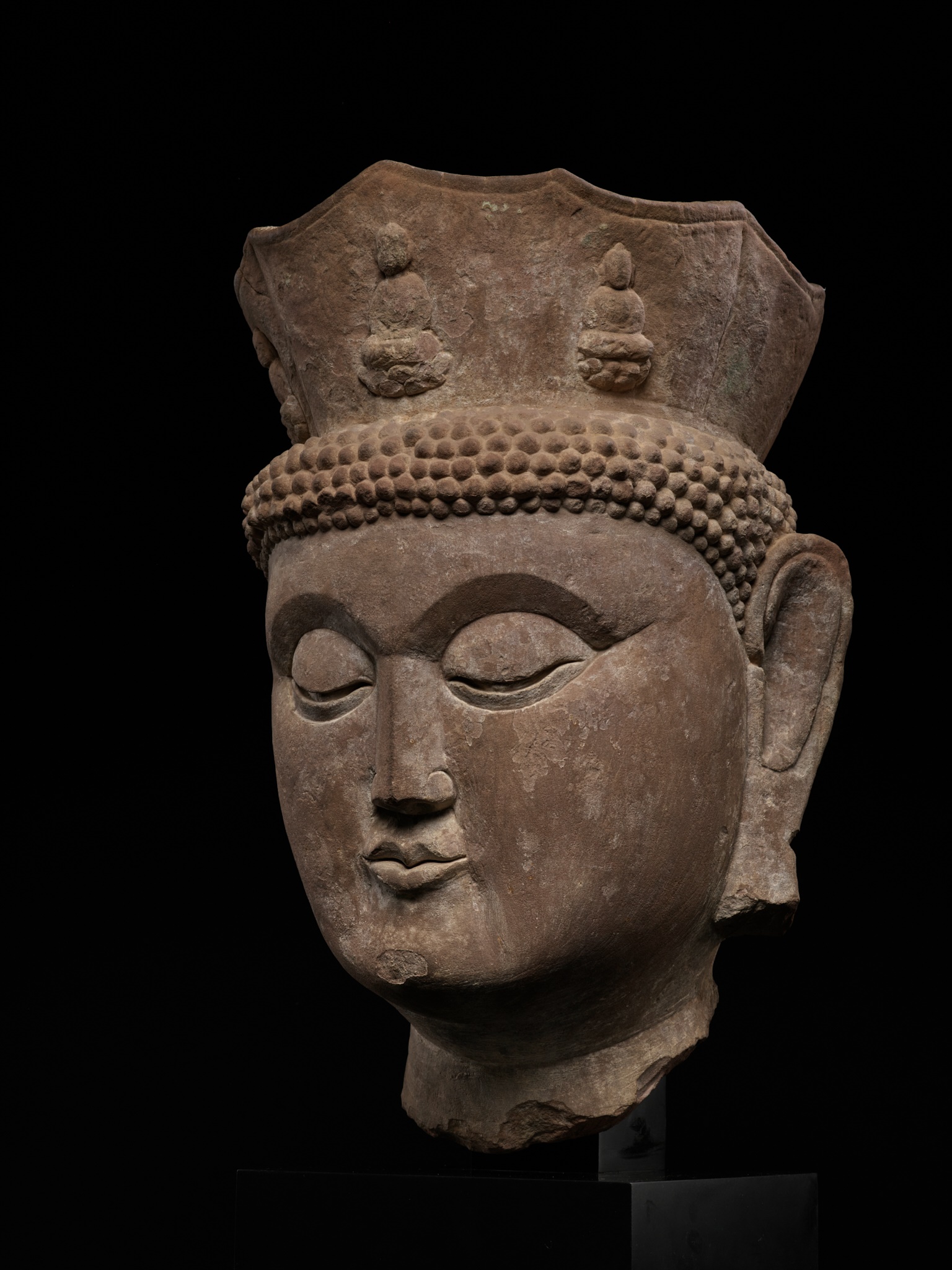 A MONUMENTAL HEAD OF VAIROCANA, THE PRIMORDIAL BUDDHA, CIRCA 500-800 AD - Image 2 of 13