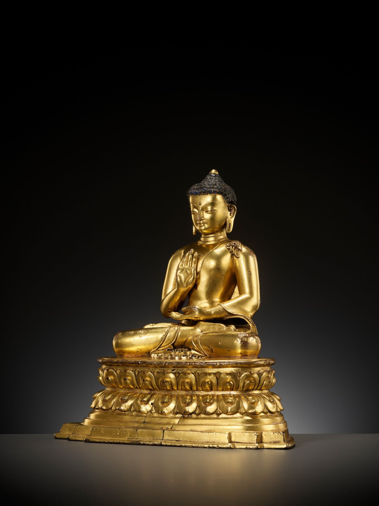 A GILT COPPER ALLOY FIGURE OF AMOGHASIDDHI, POSSIBLY DENSATIL, TIBET, 14TH-15TH CENTURY - Image 10 of 22